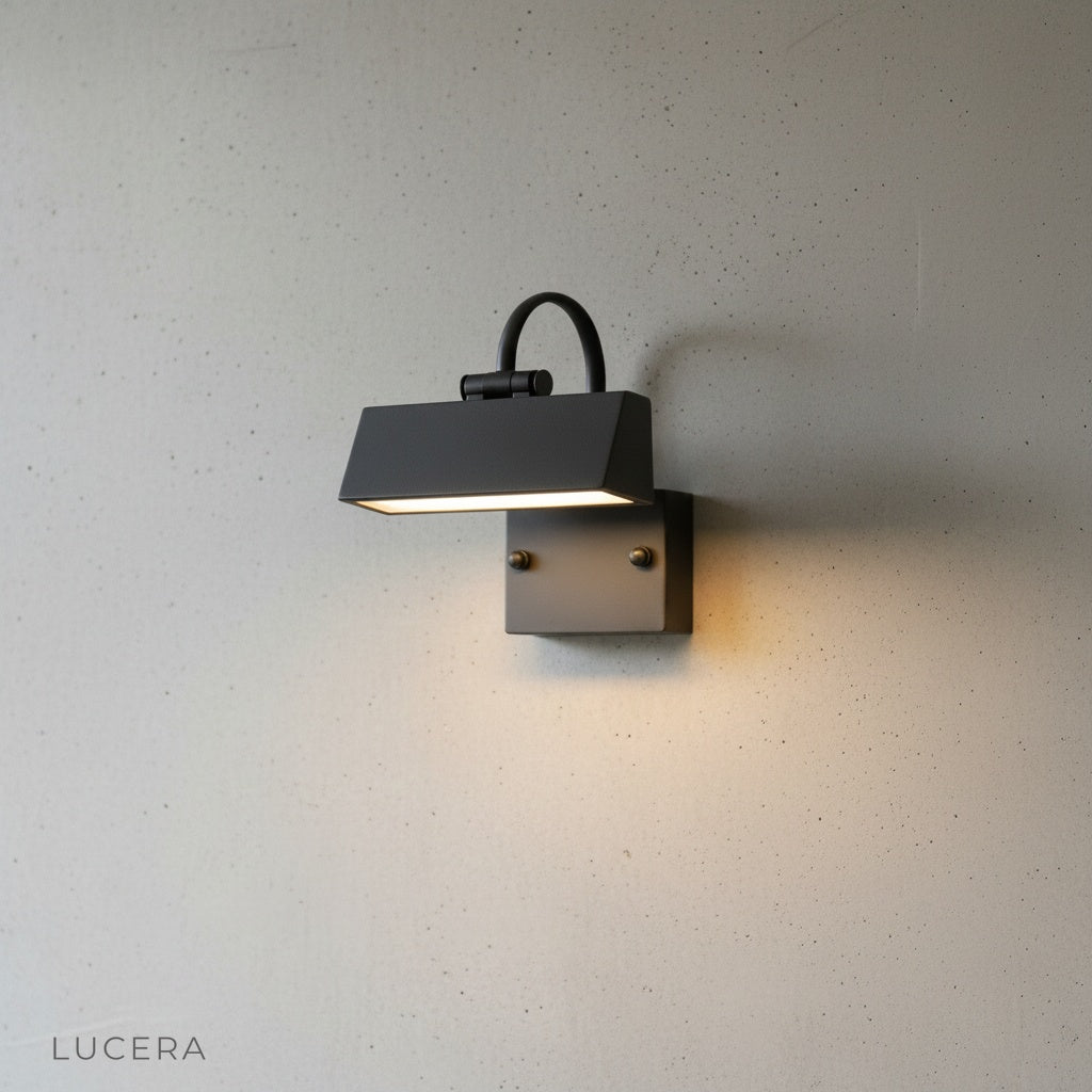 Close-up of Quiete wall lamp showing durable metal frame and frosted acrylic diffuser