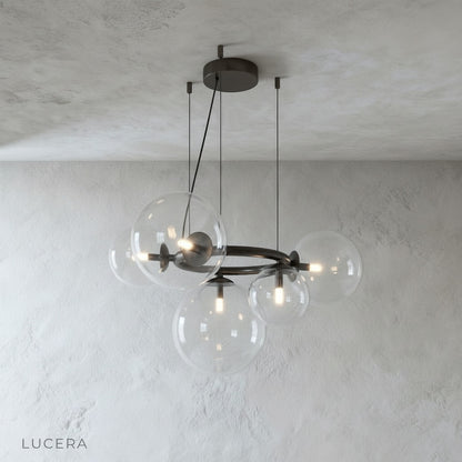 Close-up of Grenache chandelier glass sphere cluster refracting warm light