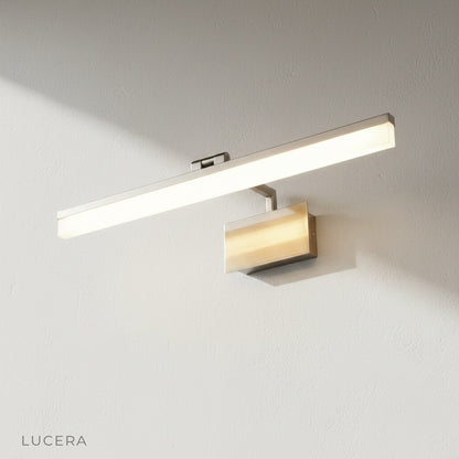 black finish balance wall lamp with adjustable arm in studio setting