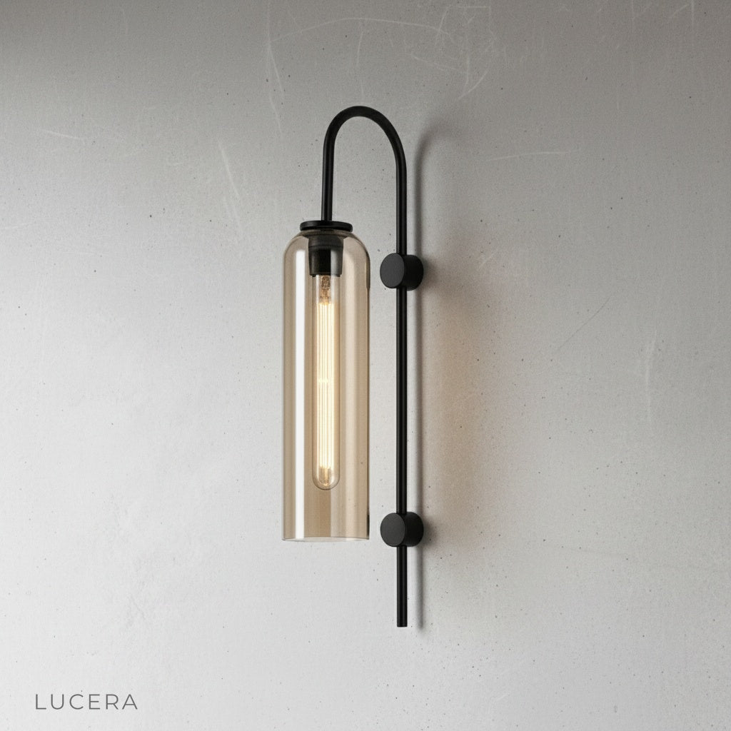 close-up of clear glass shade and brushed metal fixture details