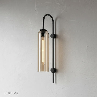 close-up of clear glass shade and brushed metal fixture details