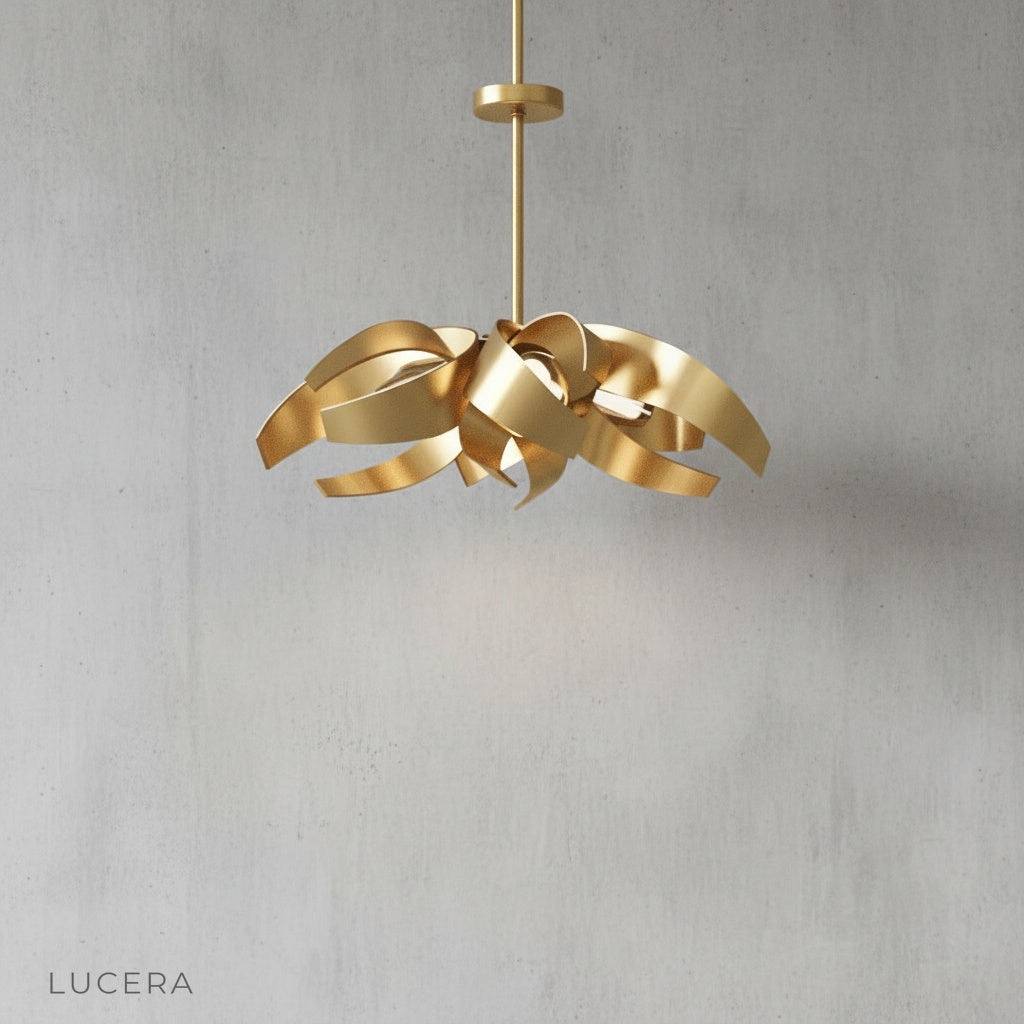 Incanto Chandelier front view studio photography highlighting sculptural metal ribbon curves