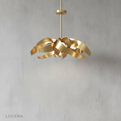 Incanto Chandelier front view studio photography highlighting sculptural metal ribbon curves