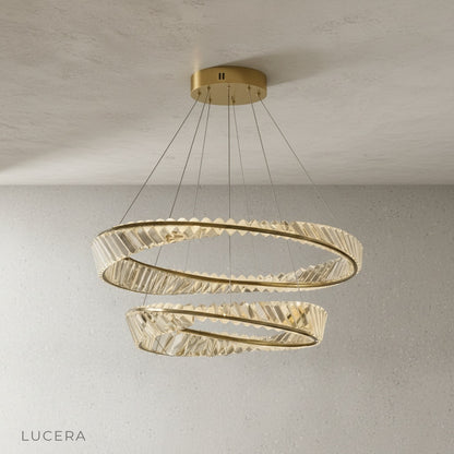 close-up detail of crystal lampshades and innovative light-refracting rings on Umbilicus chandelier