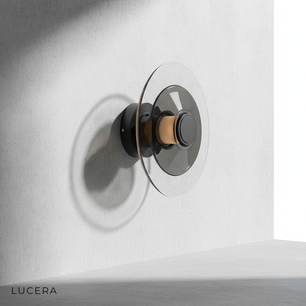 Domo Disc amber glass sconce illuminating cozy reading nook with soft 3000K halo