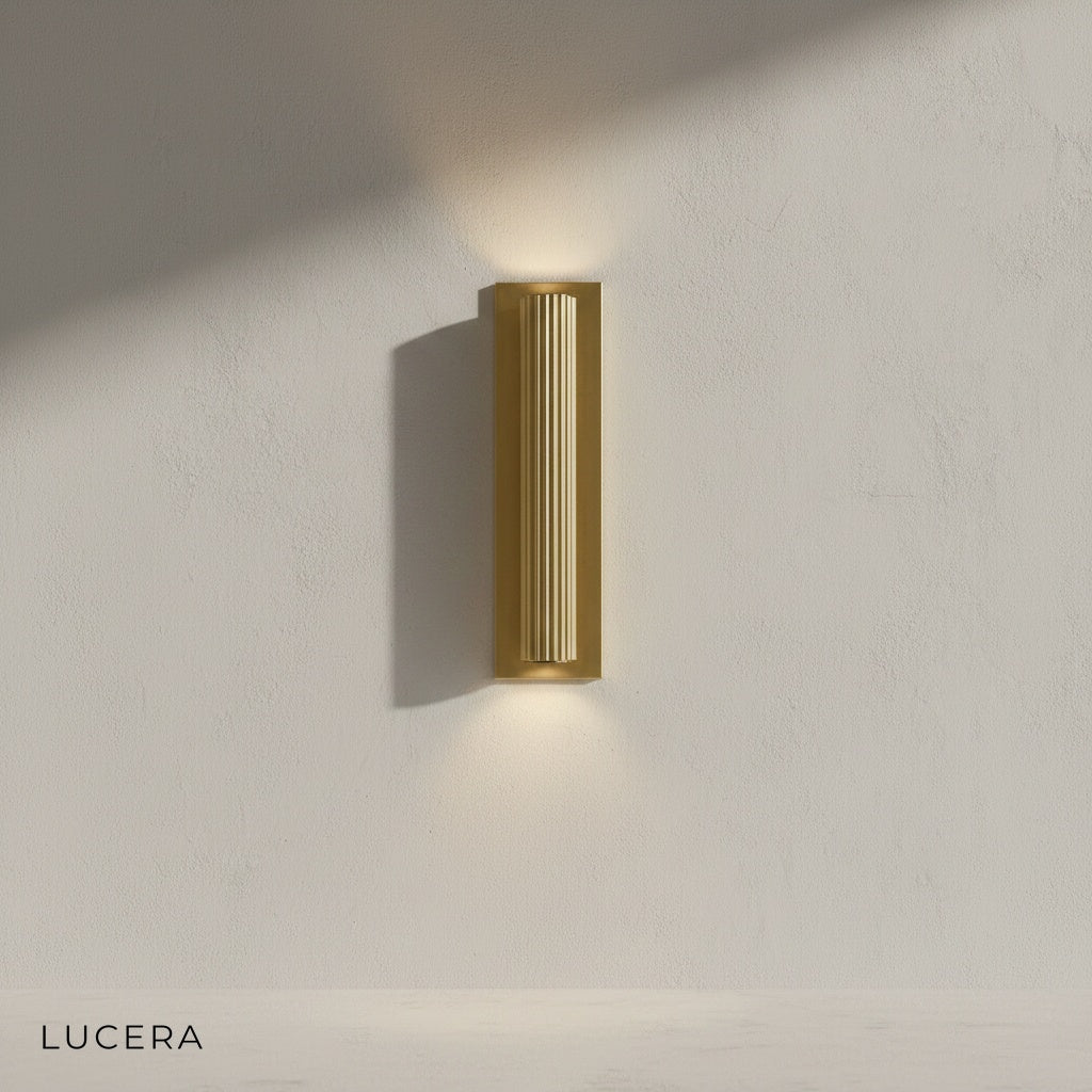 Loano wall lamp illuminating bedroom bedside with warm inviting glow at night