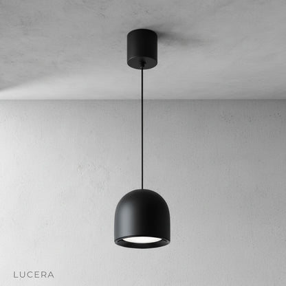 close-up of Trinity pendant light metallic rim reflecting warm light
