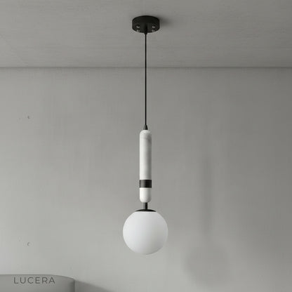Close-up of copper accents and marble texture on Groove pendant light