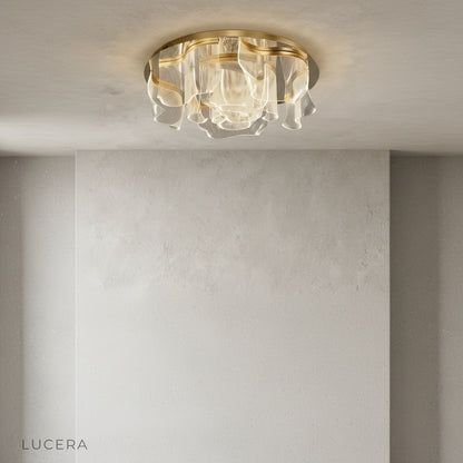 Sisyphus ceiling light close-up detail integrated LED warm glow gold texture