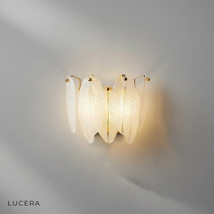 Detail of frosted glass leaf and brass arm joint on Soli chandelier