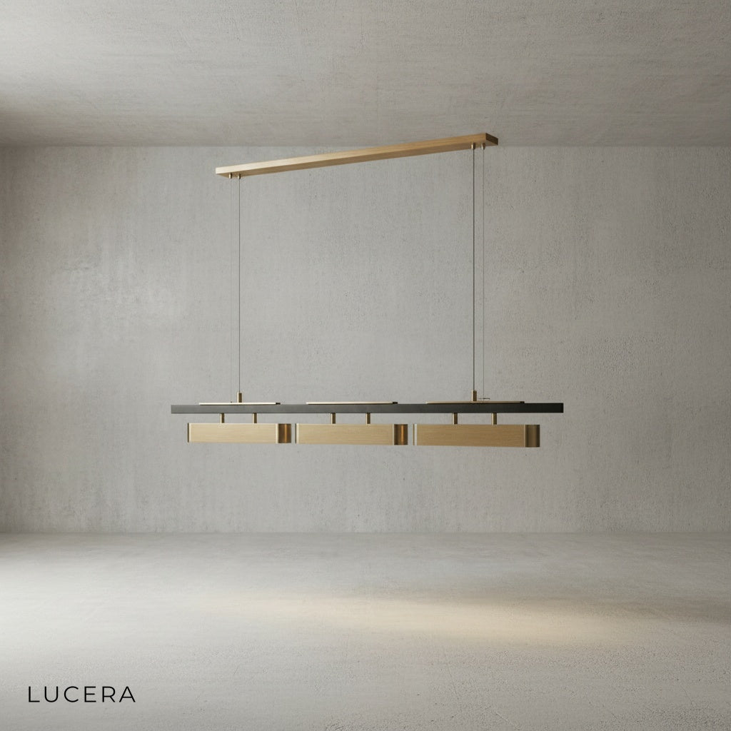 Oskar chandelier with black finish variant hanging over a kitchen island in bright daylight
