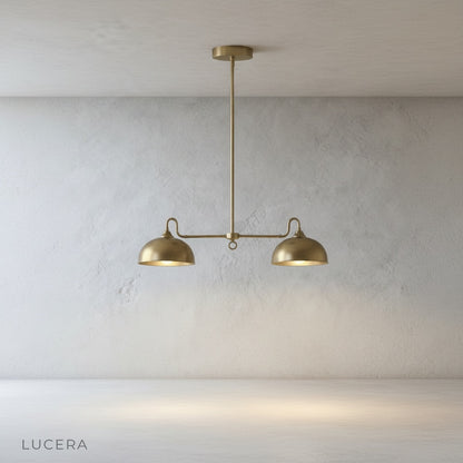 Montepulciano pendant light brass finish close-up of central stem and dome seam detail