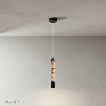 Close-up of Yseult pendant light alabaster surface with natural veining and soft internal glow