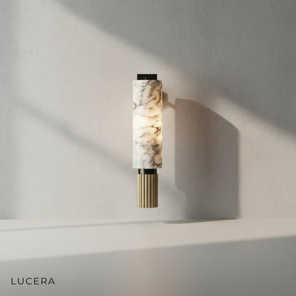 Eris Marble Sconce pair flanking a minimalist mirror in elegant bathroom setting