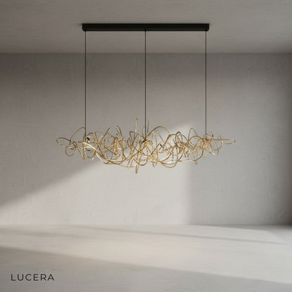 Isabelline rectangle chandelier in chrome finish hanging from ceiling in bright studio setting