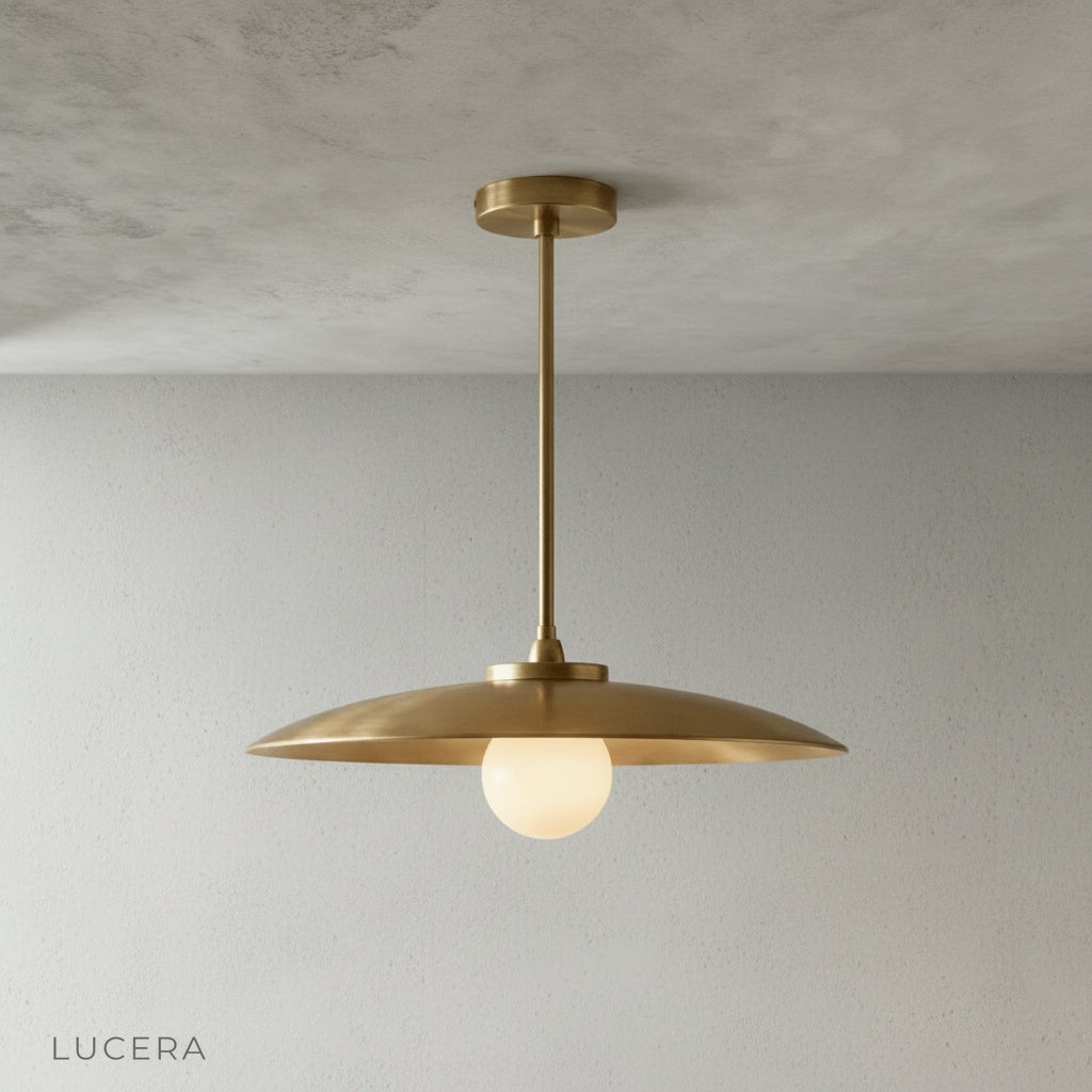 Close-up detail of Sylvaine pendant light brass surface and smooth curved edge