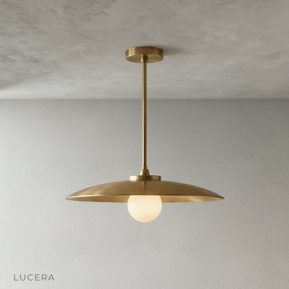 Close-up detail of Sylvaine pendant light brass surface and smooth curved edge