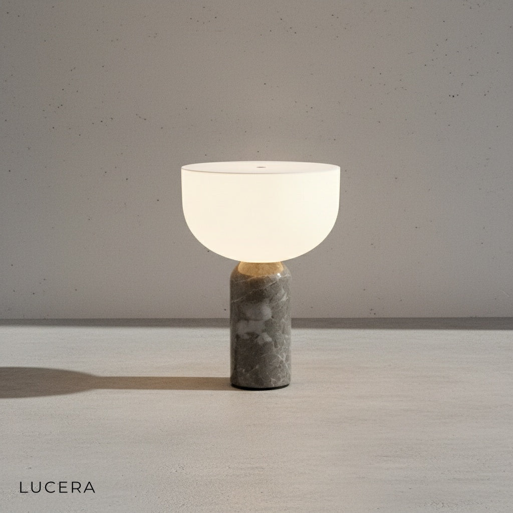 portable Stringendo LED table lamp on a bedroom nightstand casting soft ambient glow