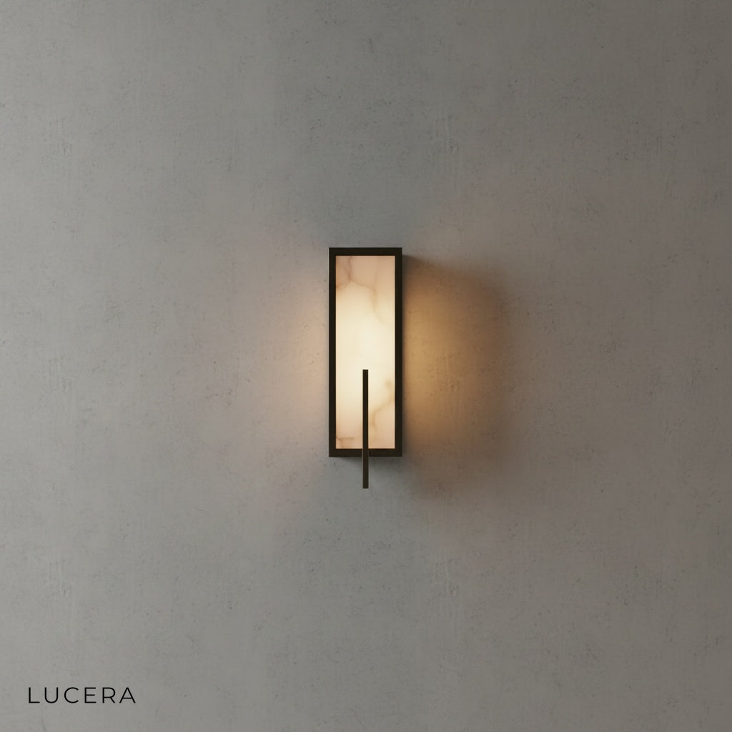 Amalfi wall lamp in matte black finish mounted on neutral plaster wall