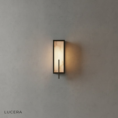 Amalfi wall lamp in matte black finish mounted on neutral plaster wall