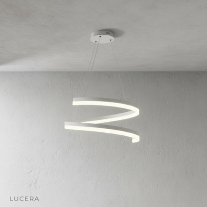 Front view of sculptural ribbon-like Hypnotize pendant light with integrated LED glow