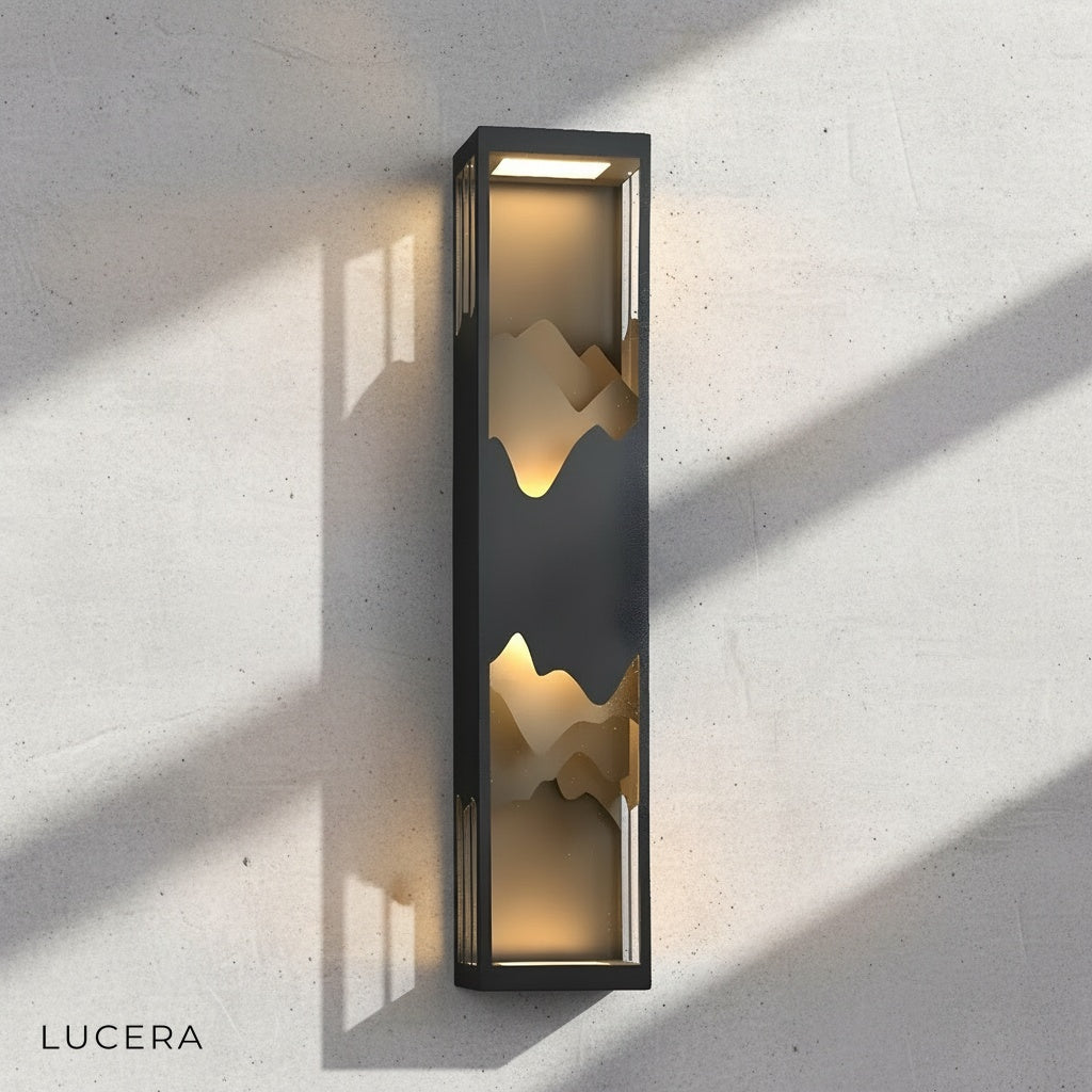 angled view of Renee wall light showing sleek rectangular silhouette