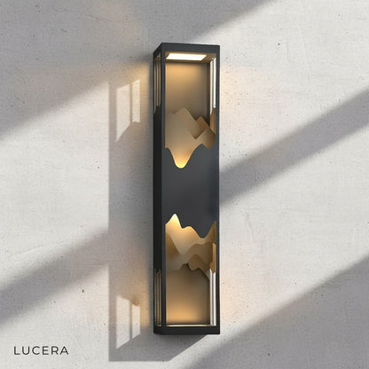 angled view of Renee wall light showing sleek rectangular silhouette