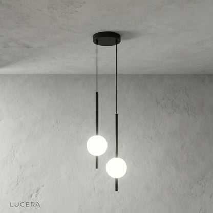 Matte black ceiling mount and cord detail of Fjord pendant light