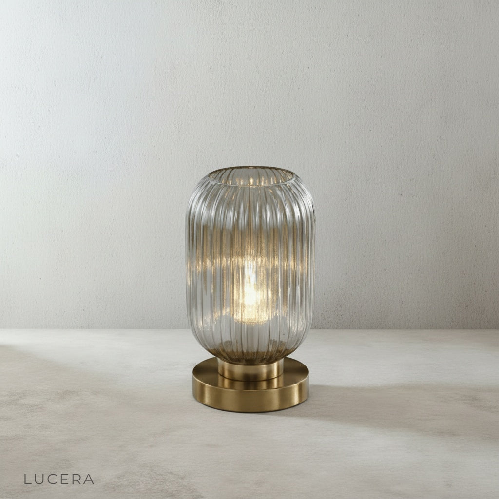 detail view of polished brass base and stem of lucera table lamp