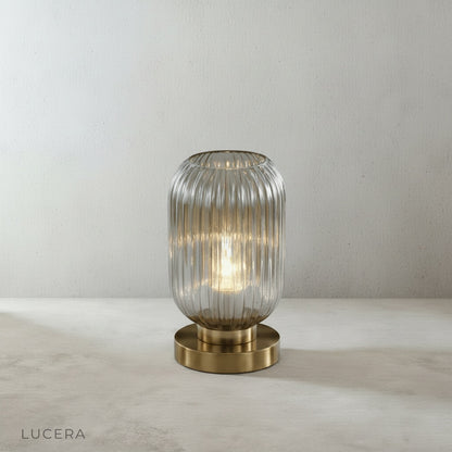detail view of polished brass base and stem of lucera table lamp