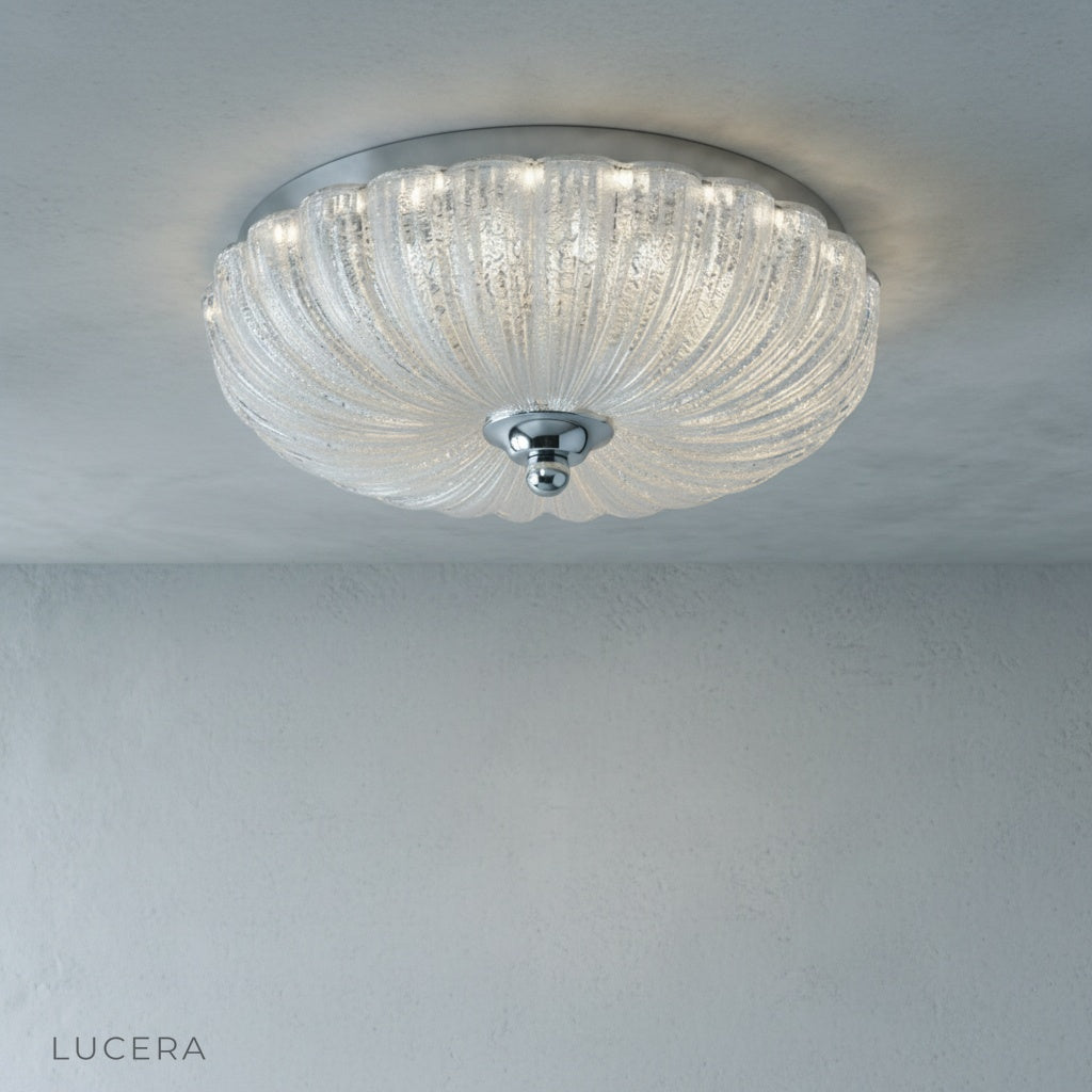 angled view of glass shade reflecting warm light in neutral interior
