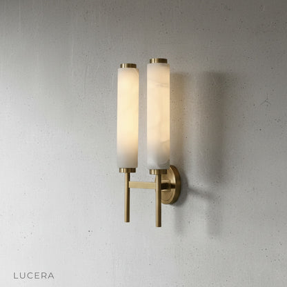 Boreas wall lamp copper structure detail against textured plaster wall in soft daylight
