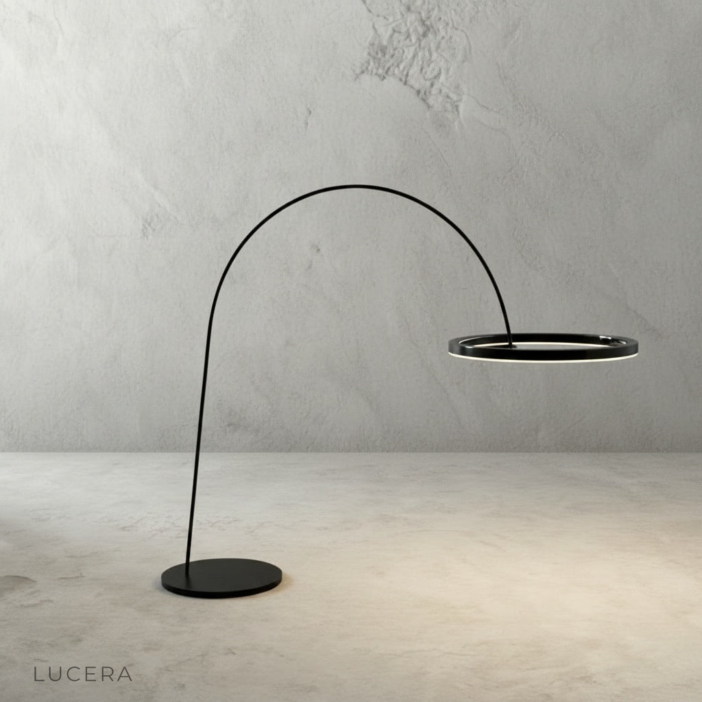 Unison floor lamp with warm glow next to sofa in cozy lounge corner