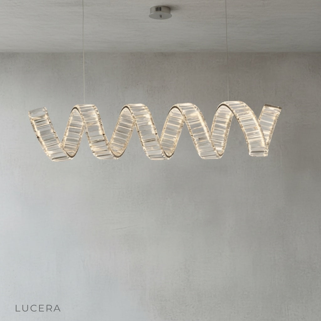 Close-up of gold-plated spiral arm and sparkling crystal accents on Davy's chandelier