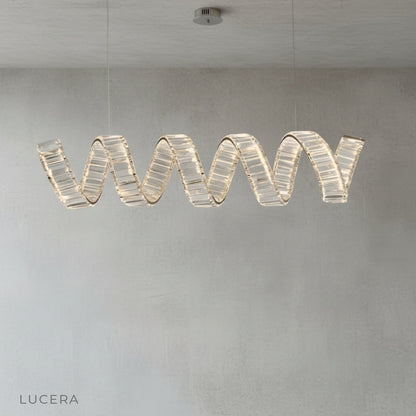 Close-up of gold-plated spiral arm and sparkling crystal accents on Davy's chandelier