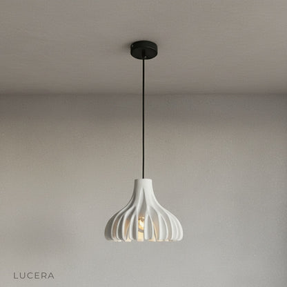 Five color options of coral pendant light arranged in row on neutral backdrop
