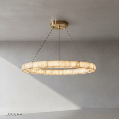 Detail view of the brushed steel suspension cables and round alabaster diffuser on the Lucera chandelier