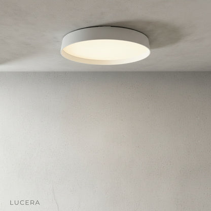 Xenith ceiling lamp illuminating minimalist hallway with warm light