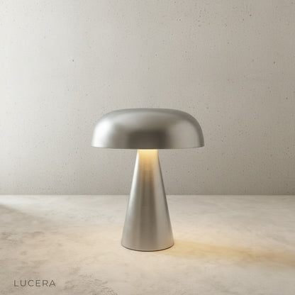 matte gold and copper Nenia table lamps side by side on shelf