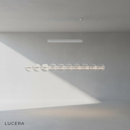 Detail of brushed aluminum bar and glass sphere connection on Vermeil fixture