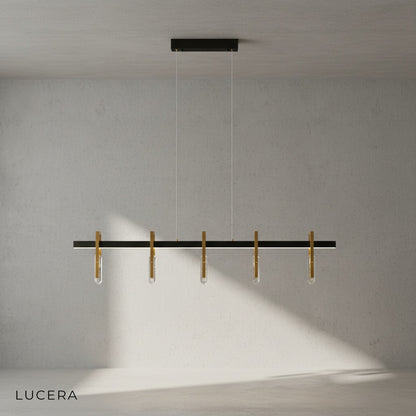 Postmodern copper crystal pendant lamp hanging above cozy reading nook with warm ambient light
