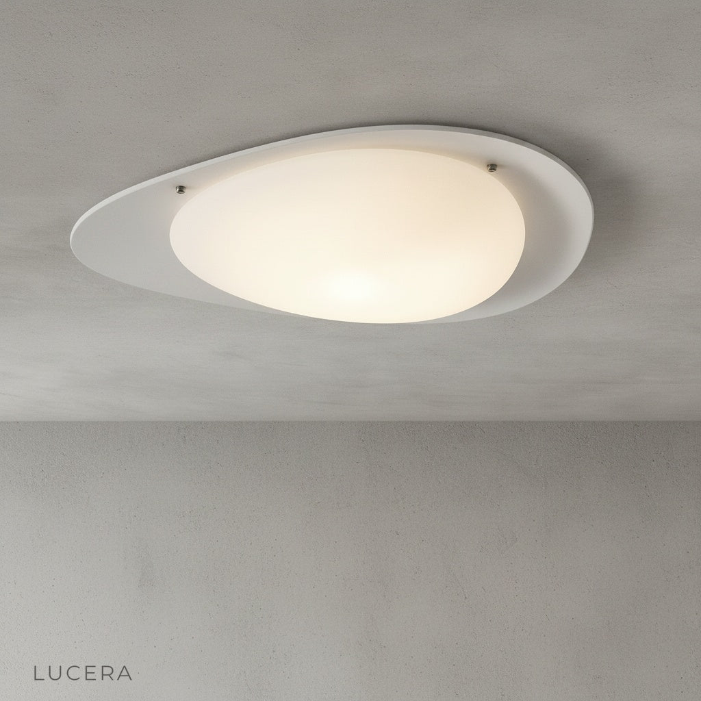 studio shot of white Saturn flush mount ceiling light on clean neutral background