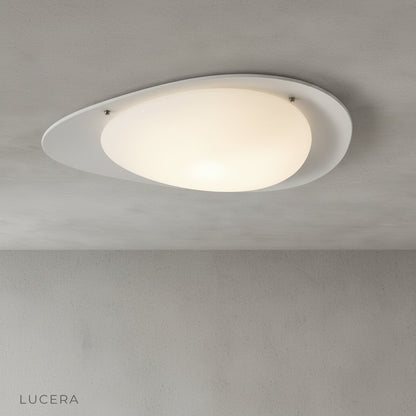 studio shot of white Saturn flush mount ceiling light on clean neutral background