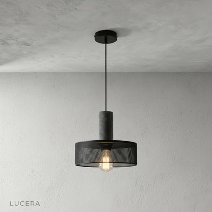 Pontiff pendant light in matte black finish suspended over wooden dining table