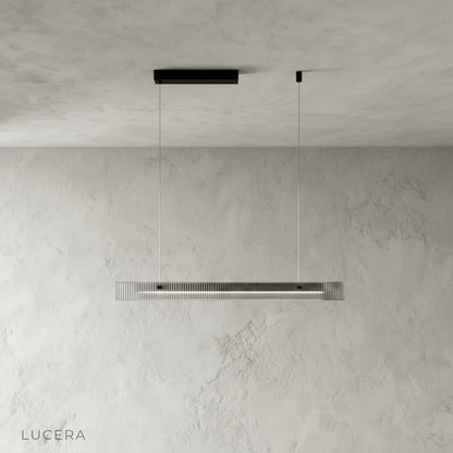 close-up of matte black iron frame and socket detailing on linear chandelier