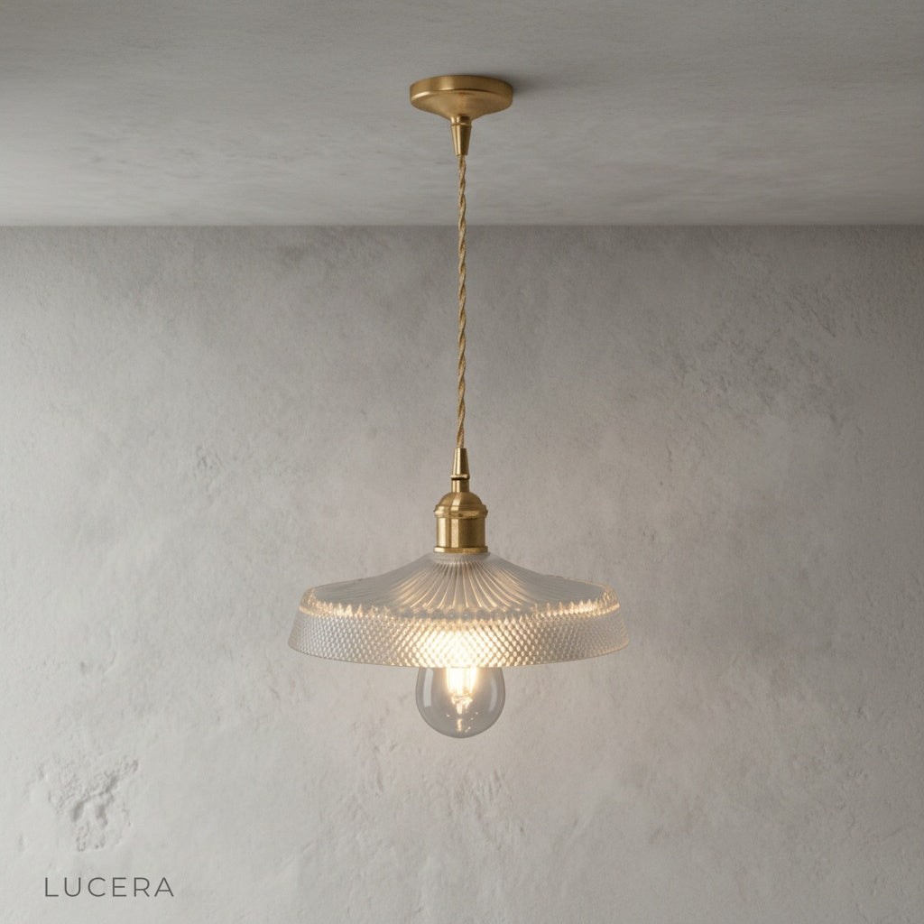 Harmony Pendant Light in vintage brass finish hanging over rustic wooden kitchen island