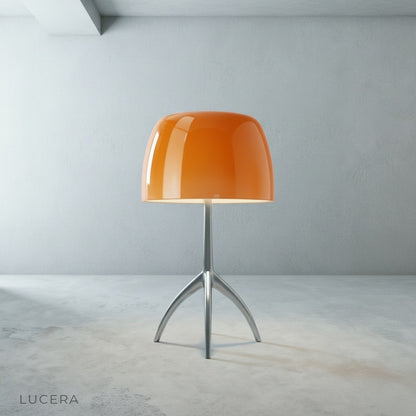 Close-up of Albescent Table Lamp glass shade revealing smooth polished surface and warm bulb glow