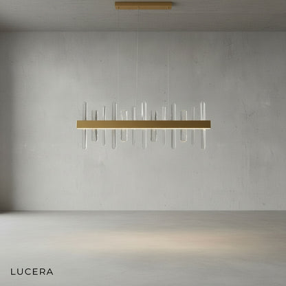 Alma chandelier with warm gold finish and crystals in bright neutral dining room