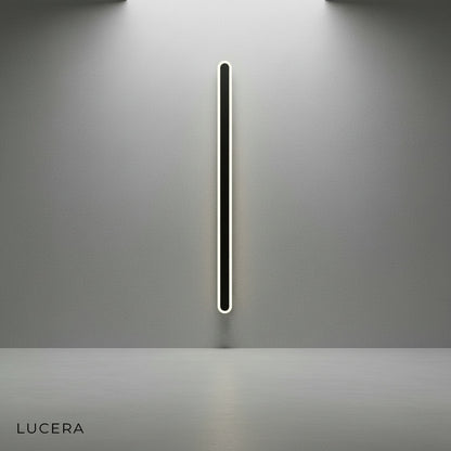 Modern acrylic wall lamp in hallway with slim profile and soft LED glow