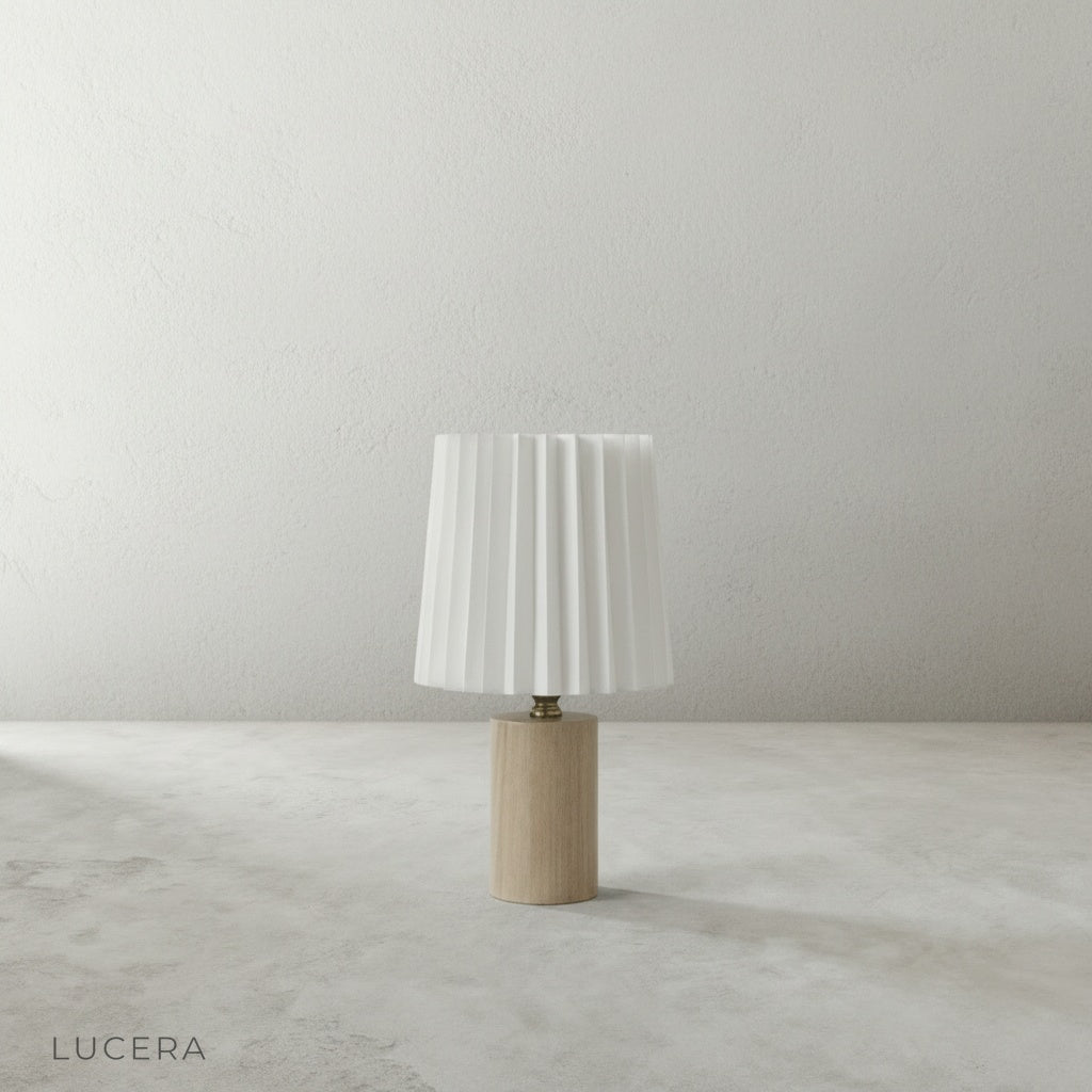Detail shot of Pandora Table Lamp cream linen pleated shade texture with soft LED light diffusing through fabric